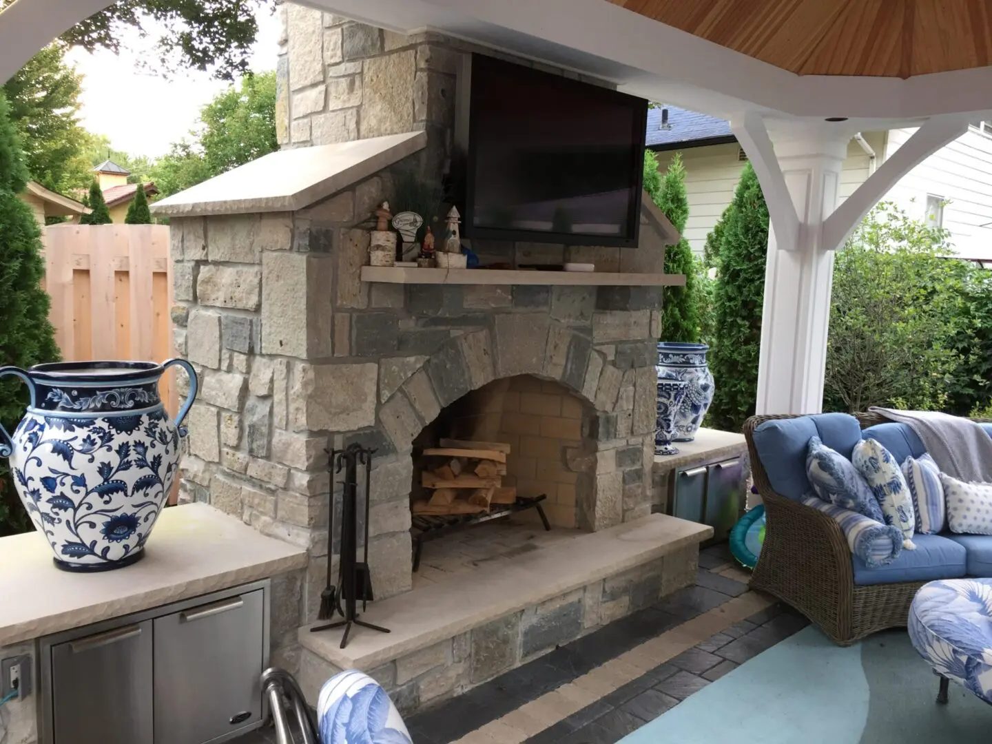 Paver patio with custom fireplace and pergola in Naperville IL