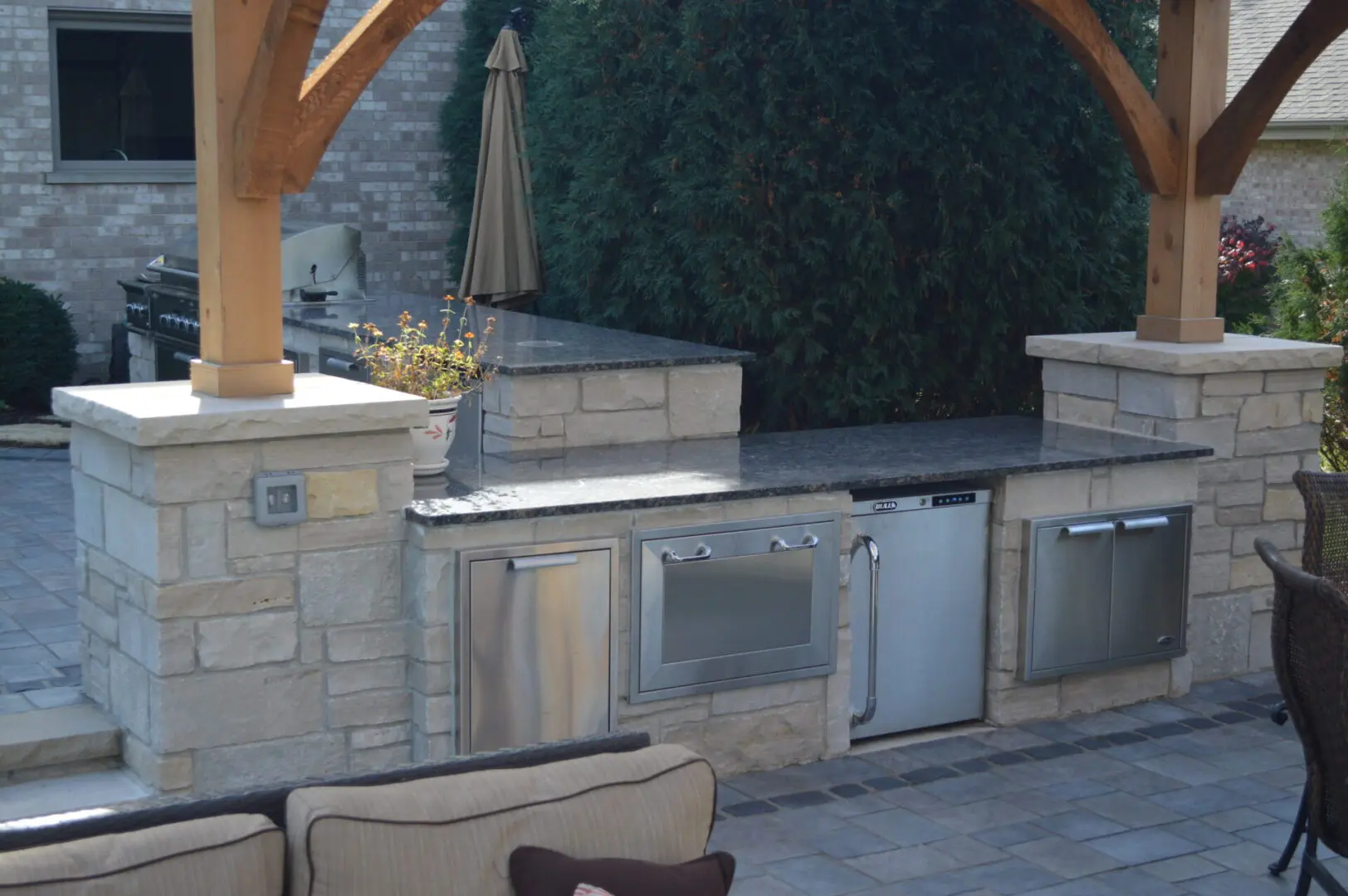 Custom outdoor kitchen cabinet with drawers and refrigerator installed in Darien, IL