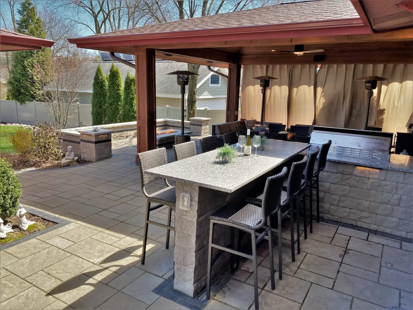Custom pavilion structure for upscale outdoor living space with bar, grill and fire pit in Willowbrook, IL