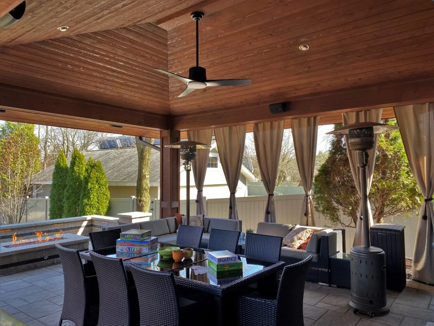 Custom pavilion with firepit, seating wall, pillars, and built in speakers, in Downers Grove, IL