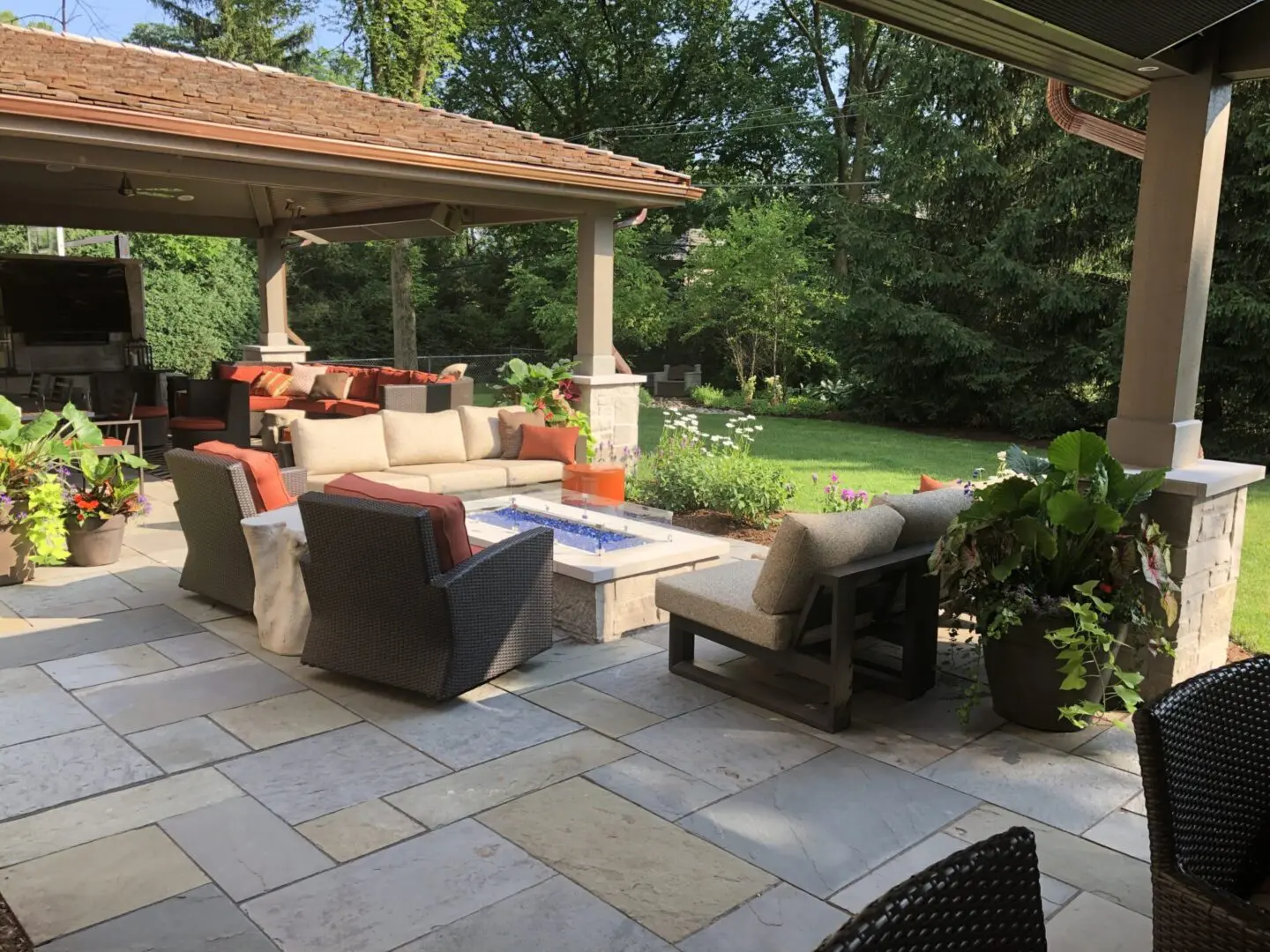 Luxury outdoor living space with custom fire pit, pergola style pavilions in Clarendon Hills, IL