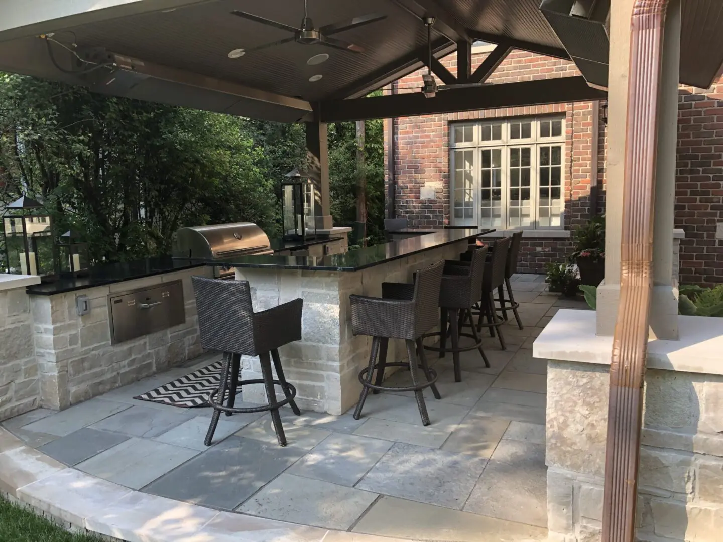 Custom outdoor roof structure with grill, fridge, and island in Hinsdale, IL