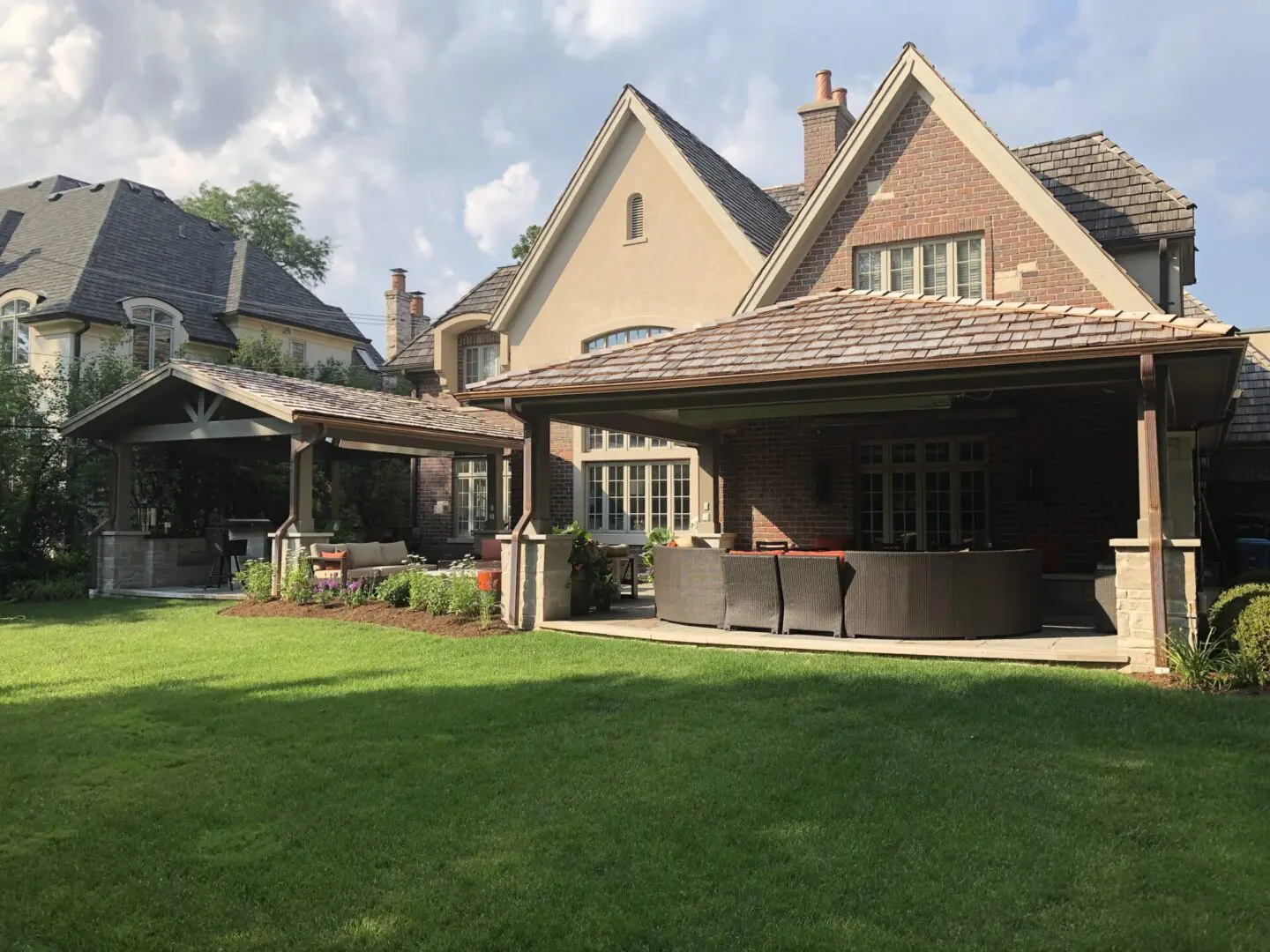 High-end outdoor pavilion with outdoor kitchen, grill, bar, firepit, and TV wall in Hinsdale, IL