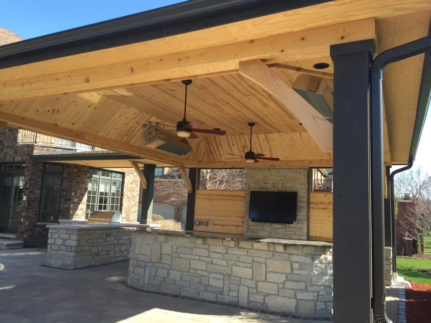 Backyard cooking area with grill, refrigerator, and storage drawers in Palos Park, IL