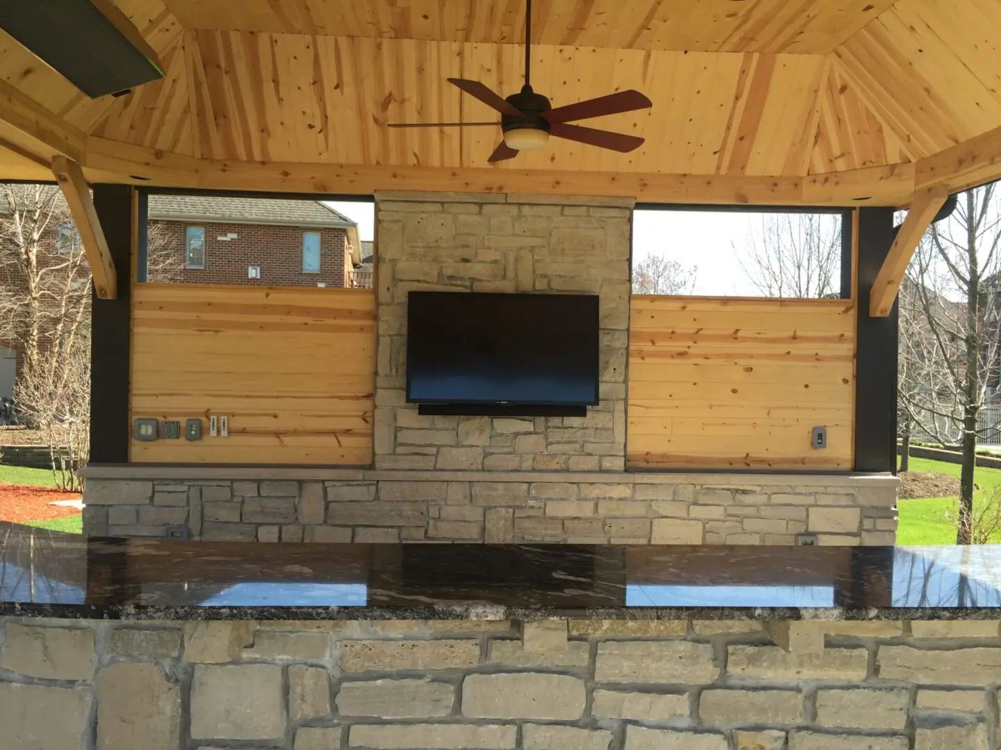 Backyard pavilion and covered patio structure installation with outdoor bar and island in Lemont, IL