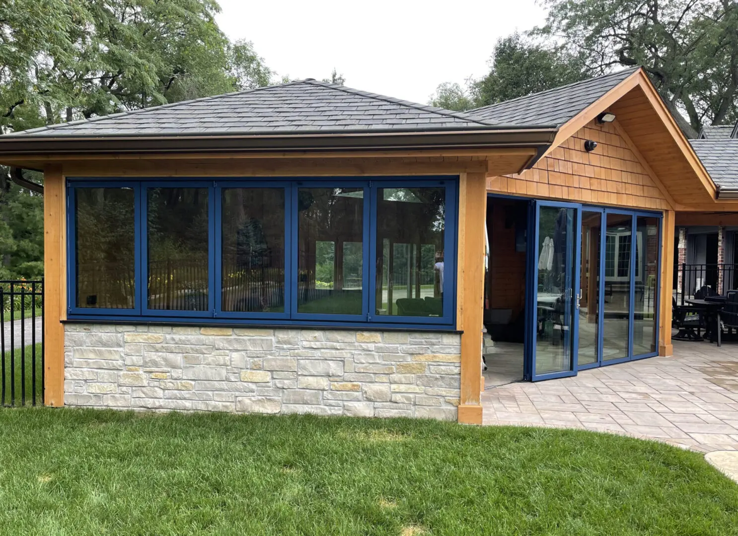 Backyard roof structure with paver patio installation in Western Springs, IL
