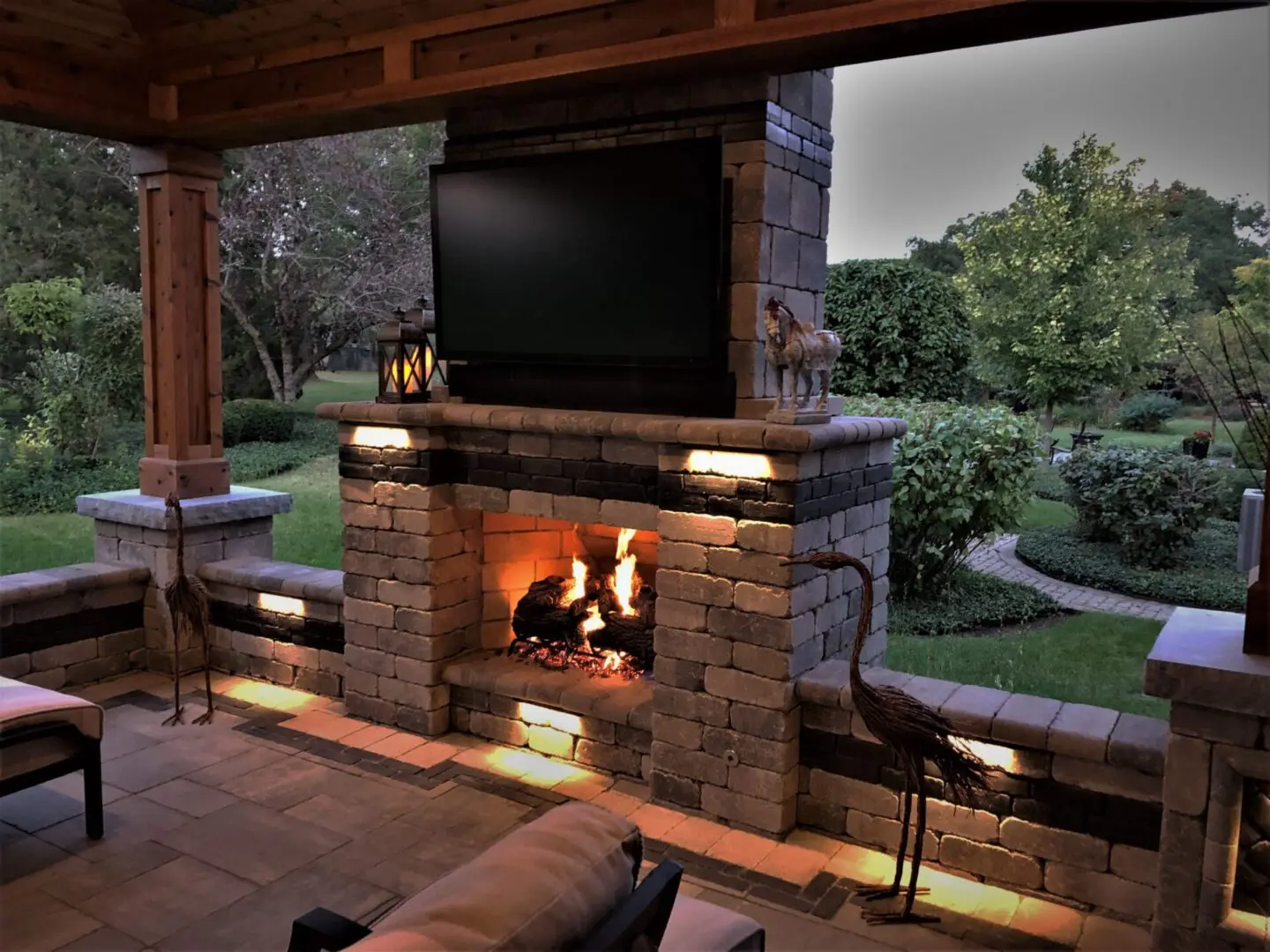 Professional landscape lighting and pavilion with fireplace in Naperville, IL