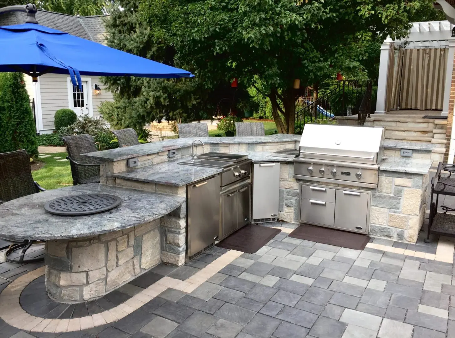 Custom outdoor island with grill, bar, refrigerator installation in Naperville, IL