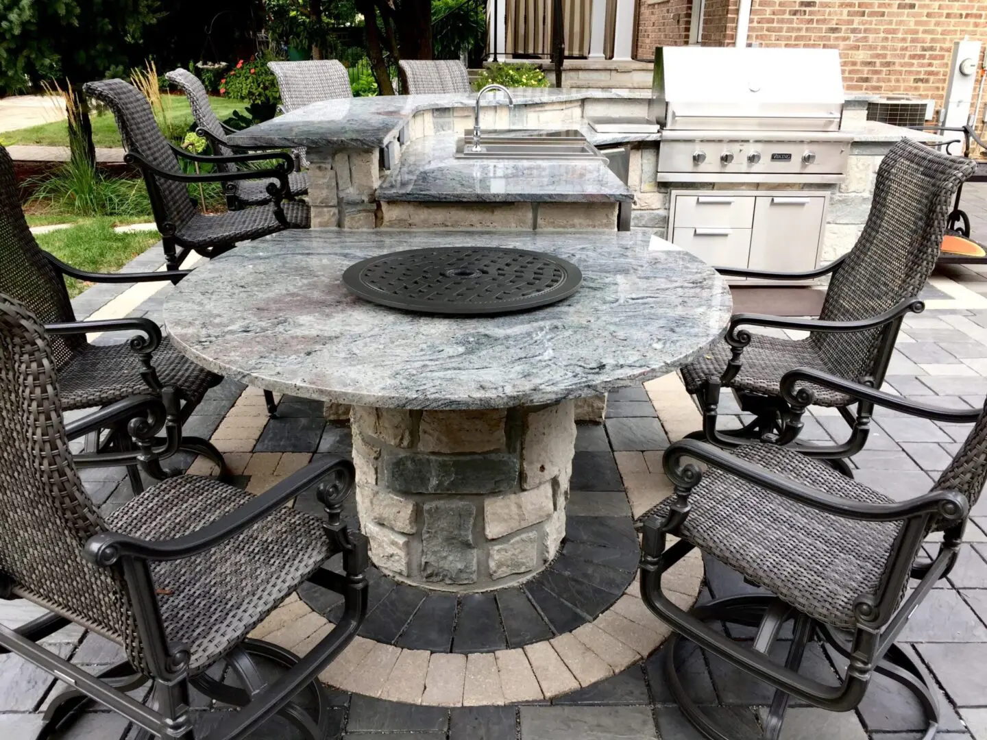 Custom granite island and bar seating area with built in grill in Hinsdale, IL