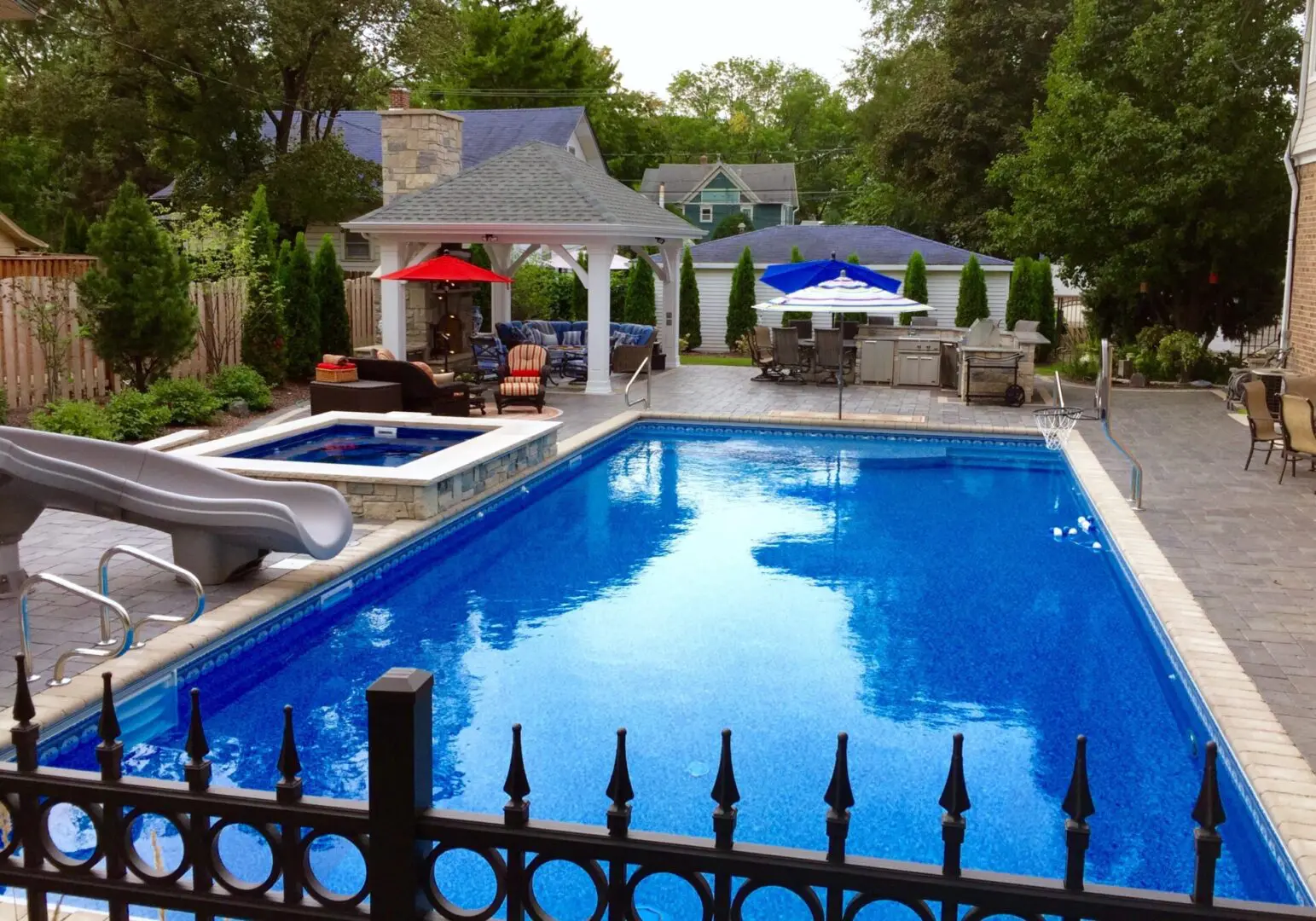 Professional pool patio with outdoor kitchen grill and refrigerator installation in Naperville, IL