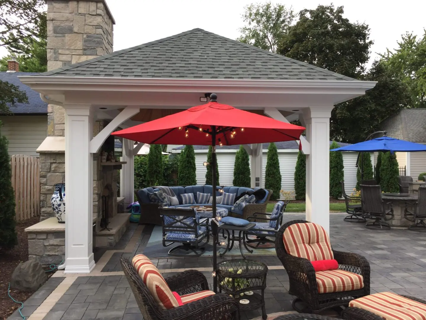 Custom pergola with fireplace and patio installation in Naperville, IL backyard