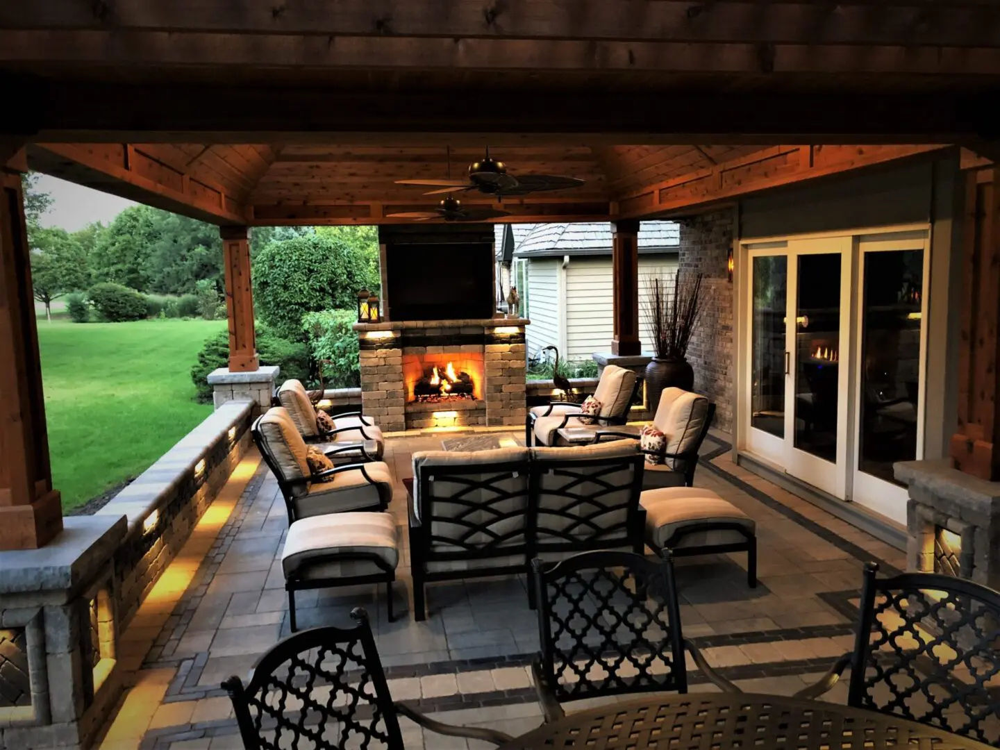 Professional landscape lighting and pavilion with fireplace in Naperville, IL