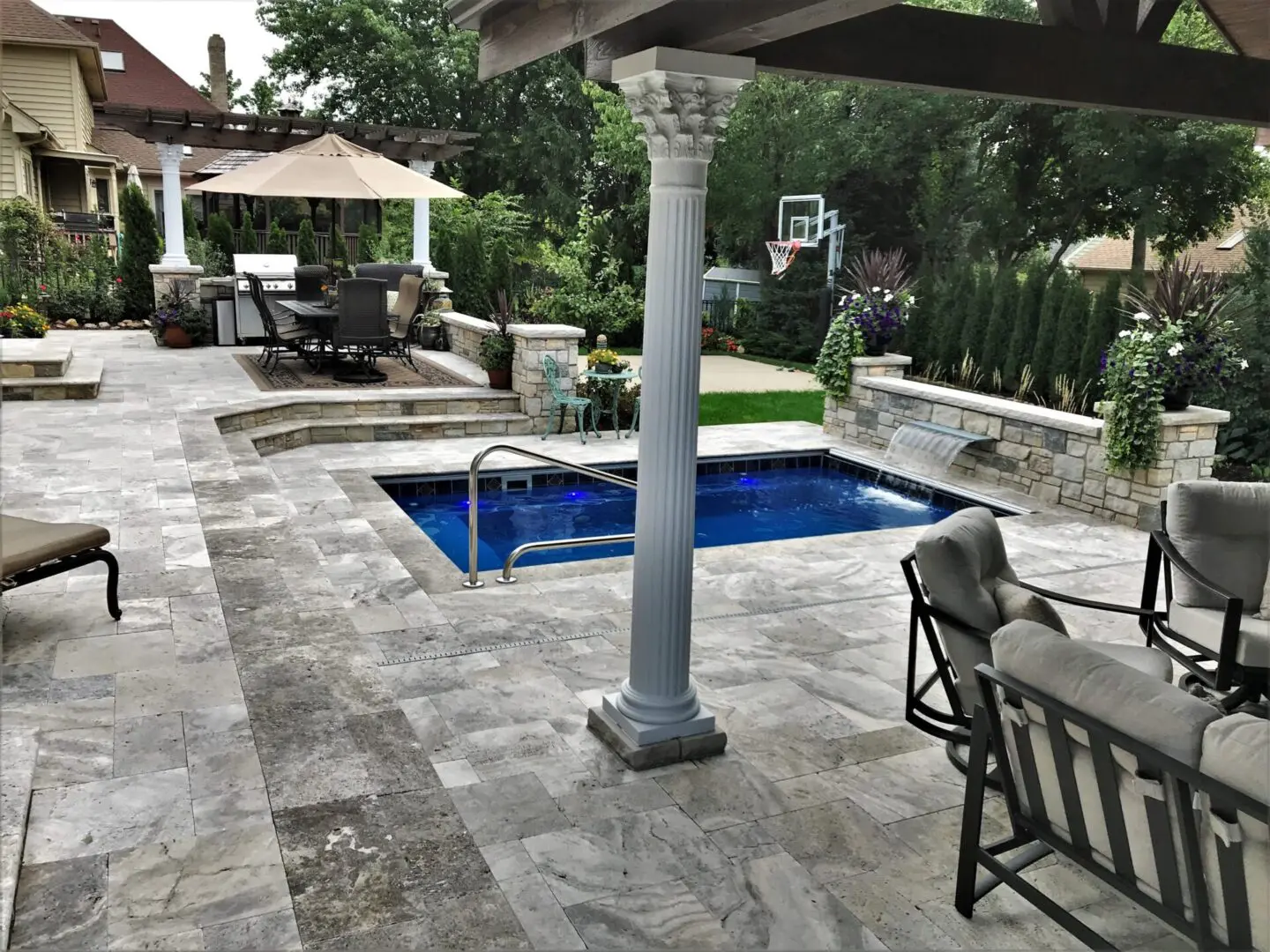 Custom patio around pool and pavilion installation in Western Springs, IL