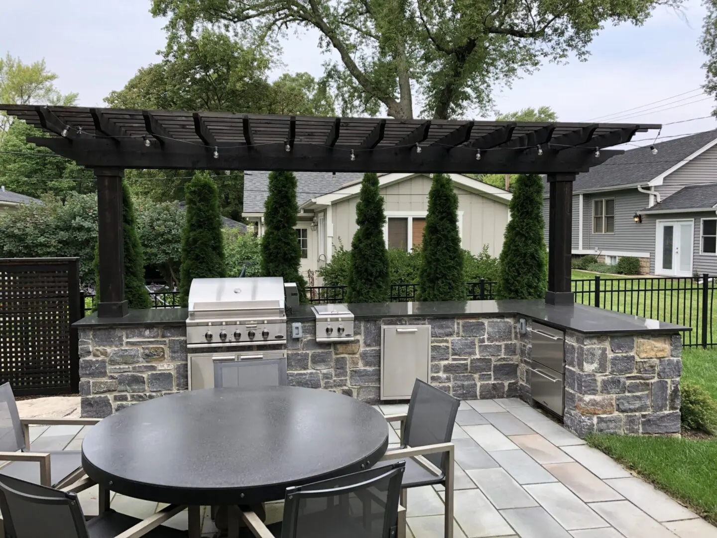 Custom pergola installed over outdoor kitchen and paver patio Naperville IL