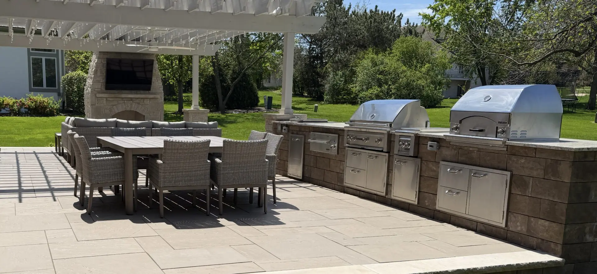 Patio with pergola and outdoor kitchen installation in Oak Brook, IL