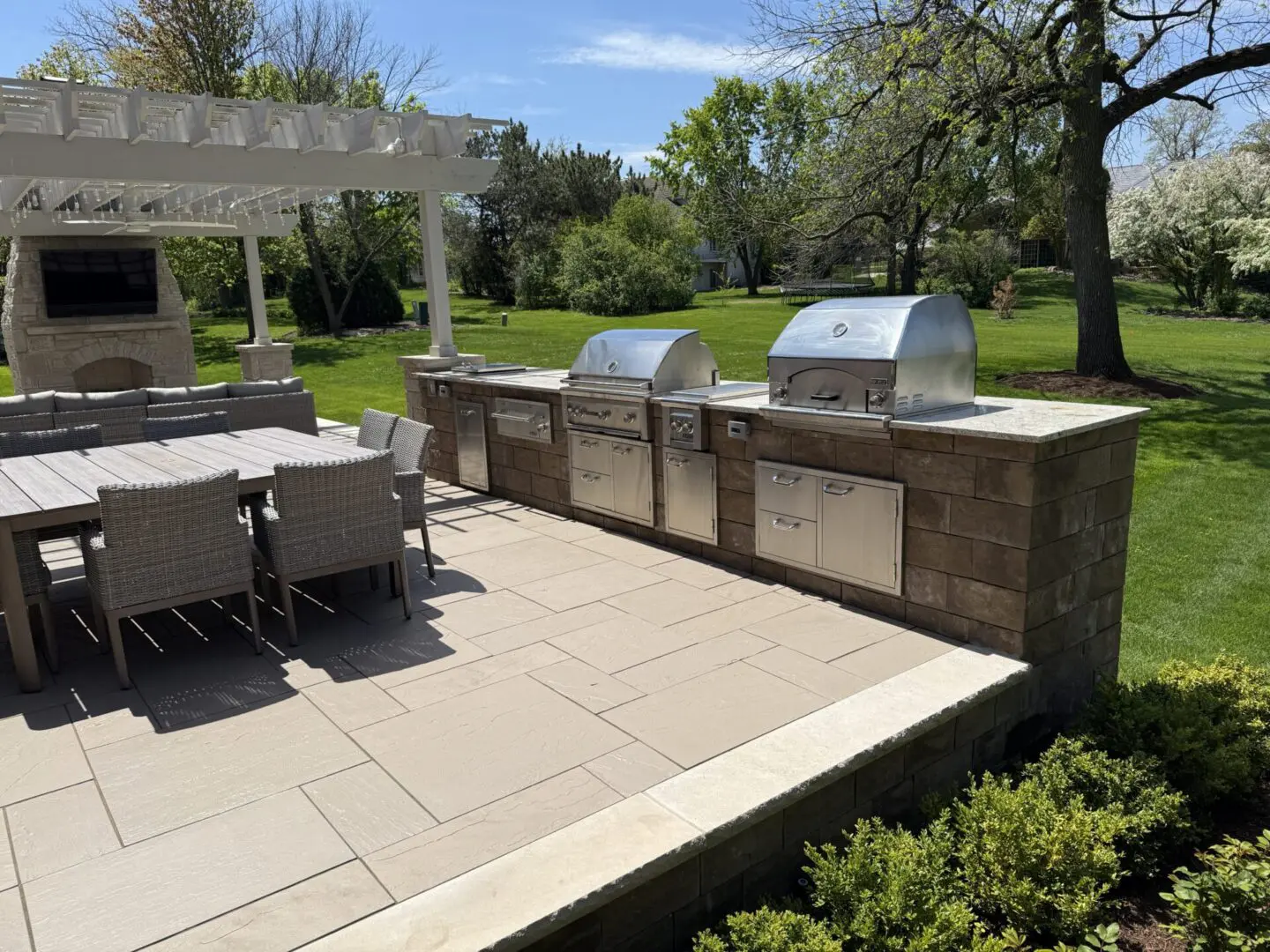Custom outdoor kitchen with grill and stone cabinet installation in Oak Brook, IL
