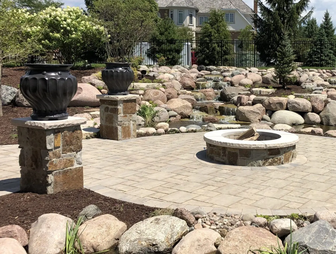Natural stone patio with custom fire pit and pavilion in Burr Ridge IL