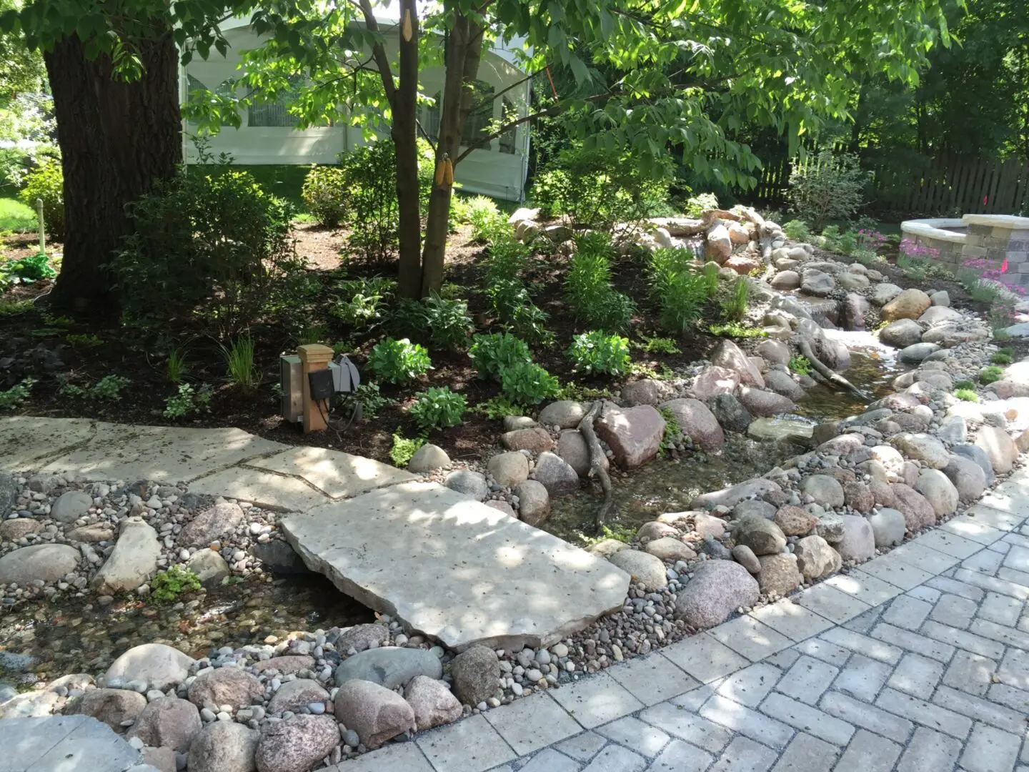 Water feature with waterfalls and 50' long stream in Clarendon Hills, IL