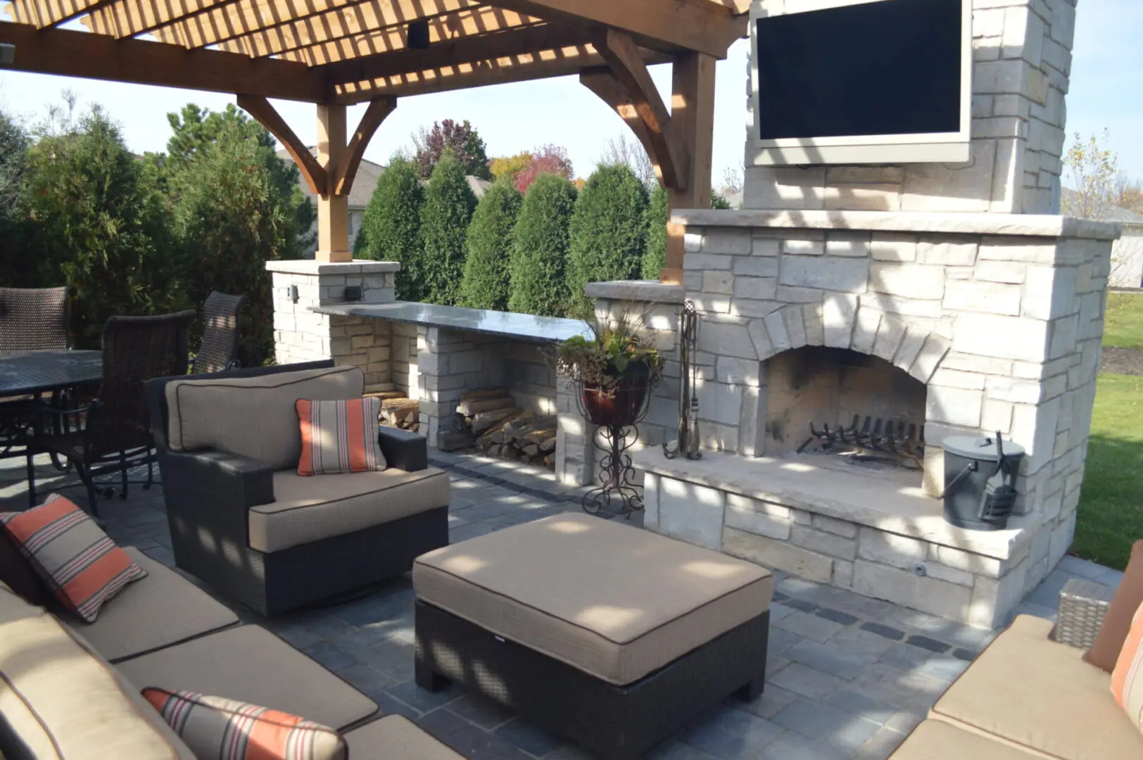Paver patio with custom fireplace and pergola in Naperville IL