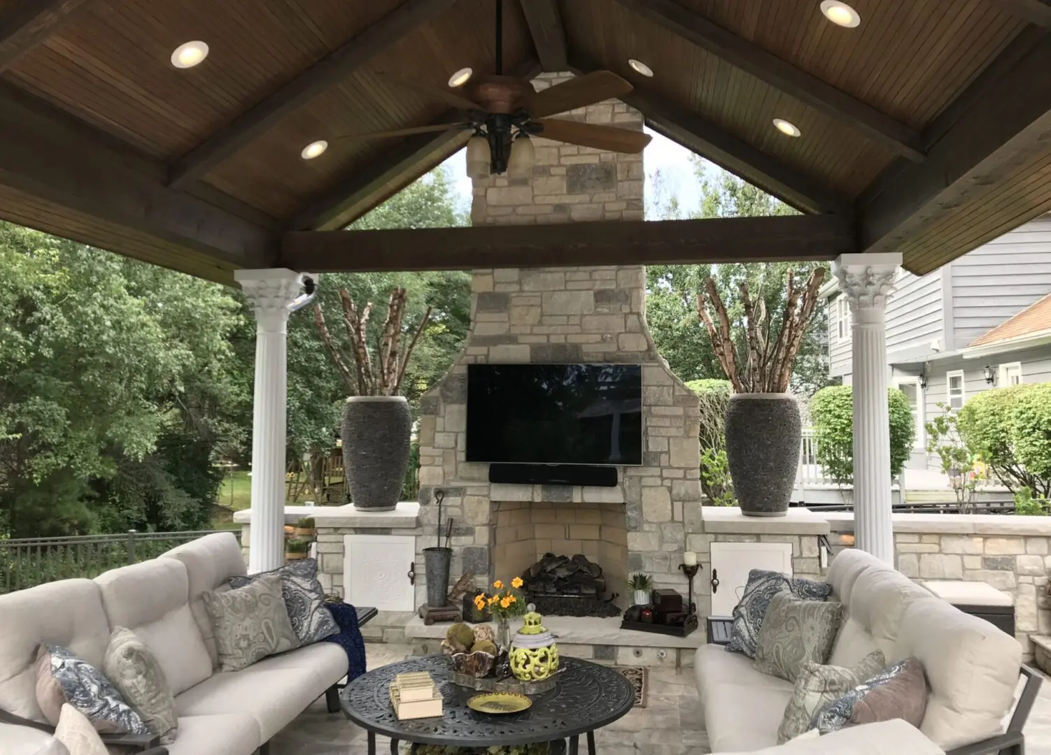 Paver patio with custom fireplace and pergola in Oak Brook IL