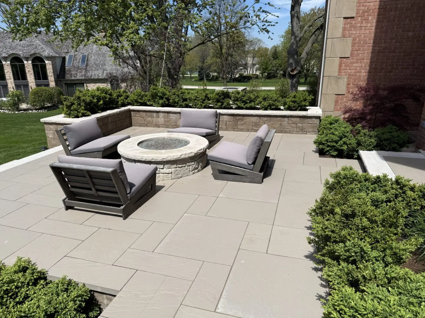 Natural stone patio with custom fire pit in Clarendon Hills IL