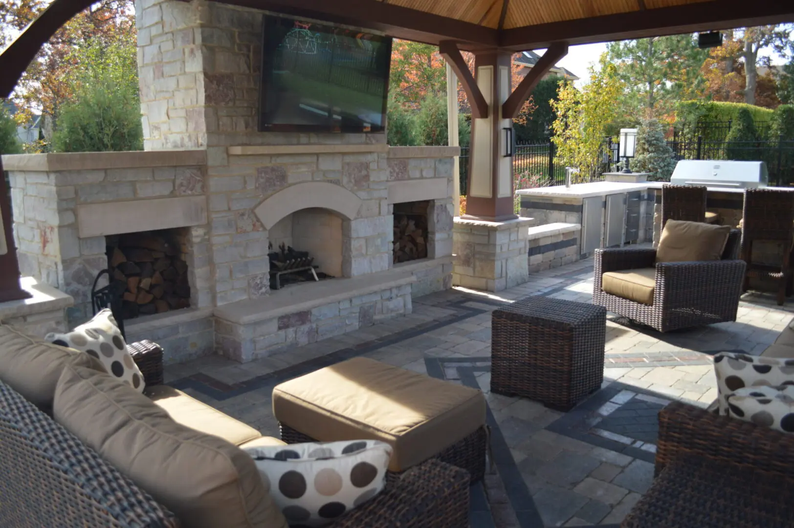 Natural stone patio with custom fireplace and pavilion in Lemont IL