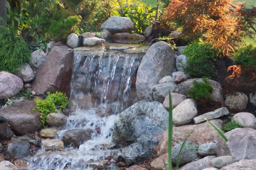 A mini stone waterfall with granite rocks