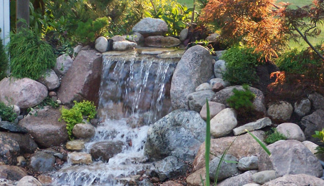 A mini stone waterfall with granite rocks