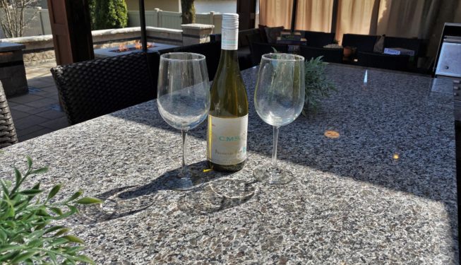 A Bottle and Two Wine Glasses on the Table