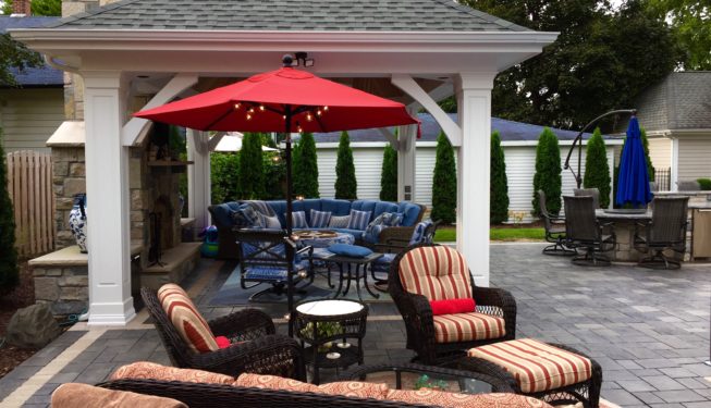 Outdoor seating area with red umbrella