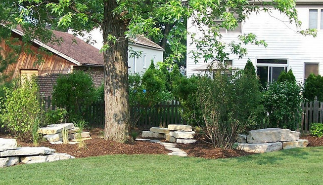 Granite stones and tree in a lawn