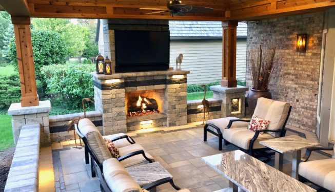 Outdoor fireplace with a ceiling
