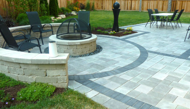 Circular stone seating area with outdoor furniture