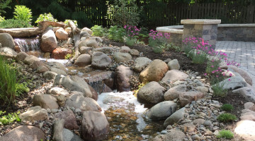 A stone cascading mini waterfall